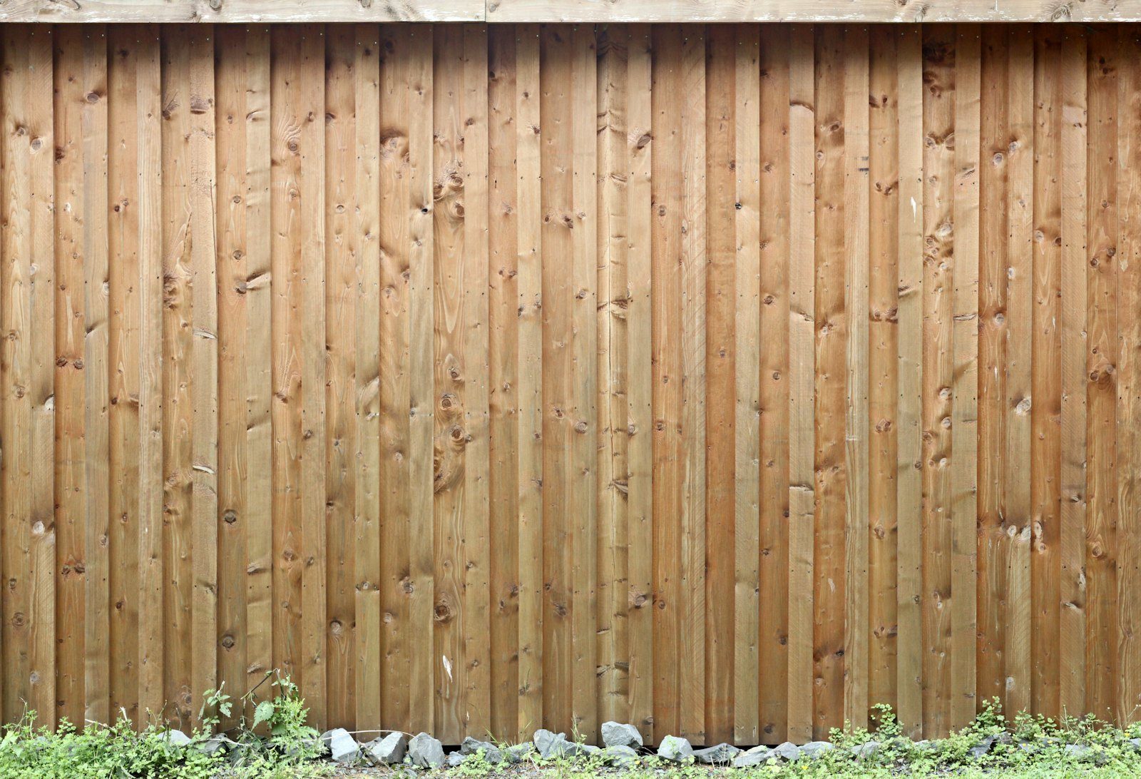 Wooden garden fencing in a UK residential garden